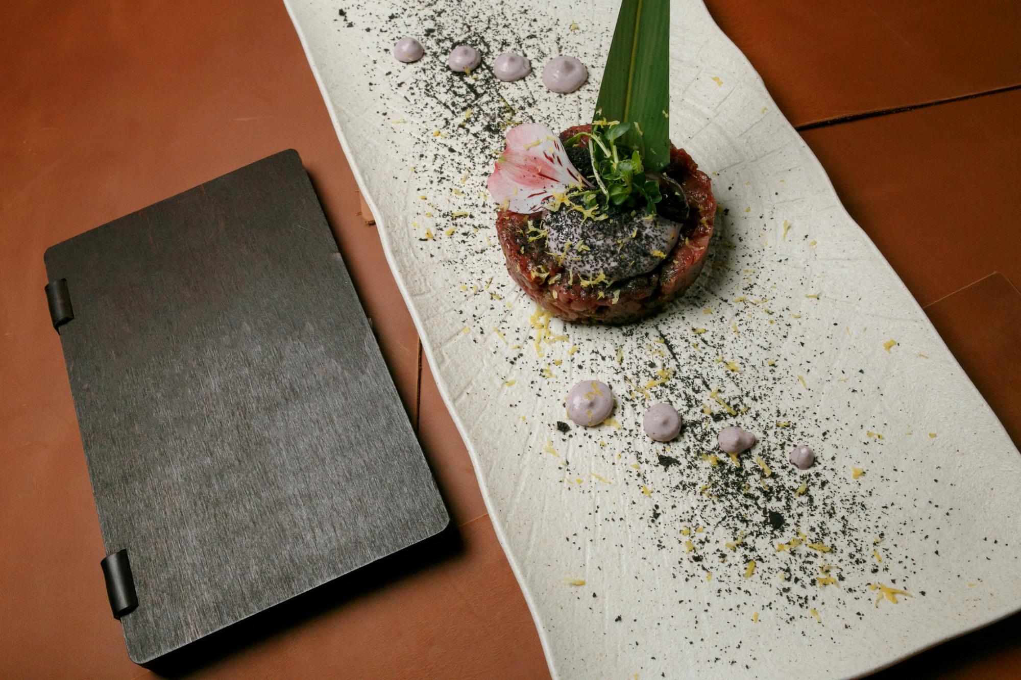 Curated tasting menu plated on slate